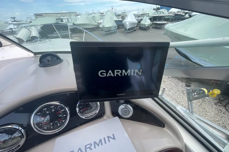 Slide: The Image of Dashboard of a 2007 Sea Ray Sundancer 260 with Garmin navigation display. - 17