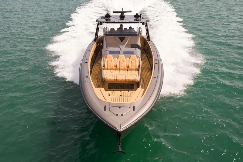 The Image of 2026 Midnight Express 52 Vitesse luxury boat cruising on open water. - 1