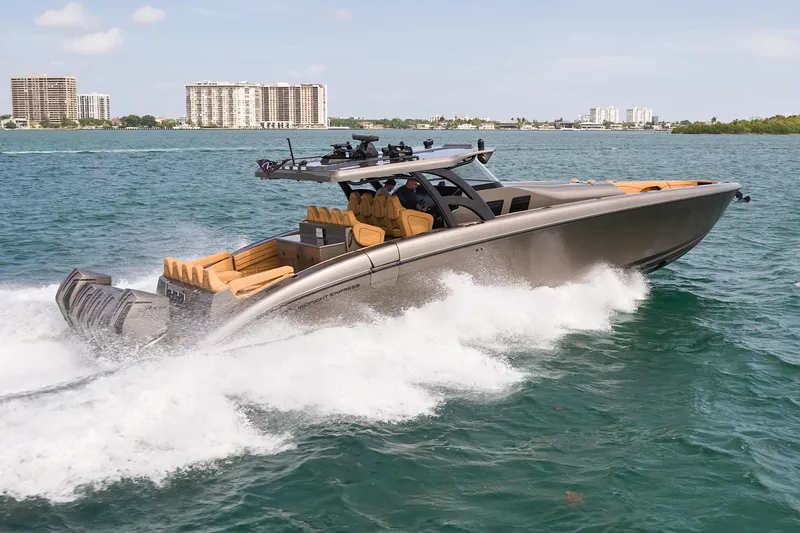 Slide: The Image of 2026 Midnight Express 52 Vitesse luxury speedboat cruising on open water. - 10