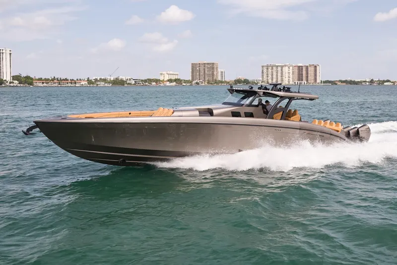 Slide: The Image of 2026 Midnight Express 52 Vitesse luxury boat cruising on open water. - 11