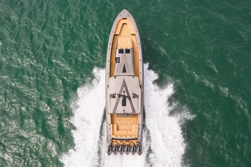 Slide: The Image of Aerial view of 2026 Midnight Express 52 Vitesse yacht cruising on open water. - 13