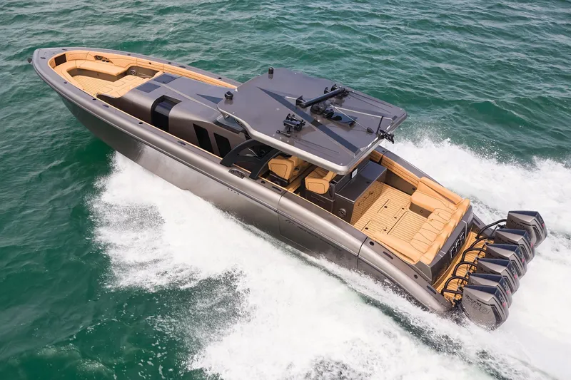 Slide: The Image of 2026 Midnight Express 52 Vitesse luxury boat cruising on open water. - 14