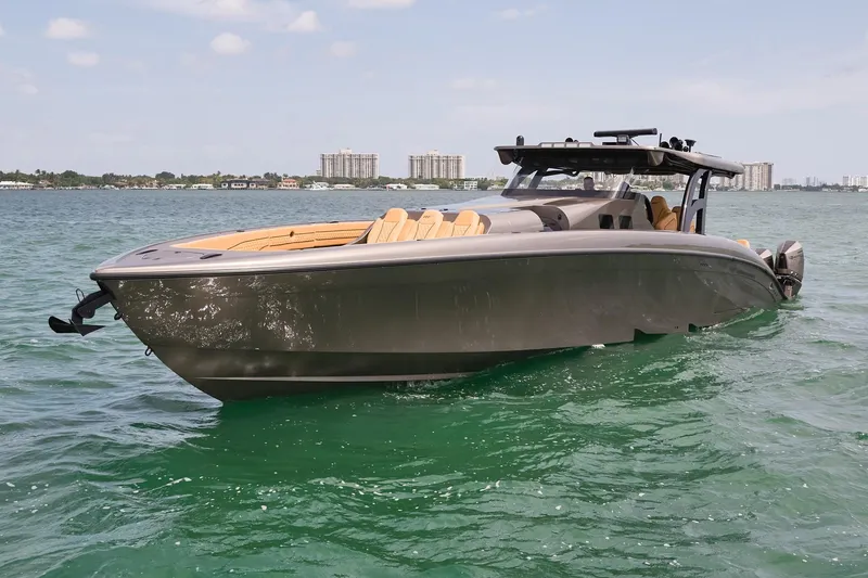 Slide: The Image of Luxury 2026 Midnight Express 52 Vitesse boat on clear water, cityscape background. - 18