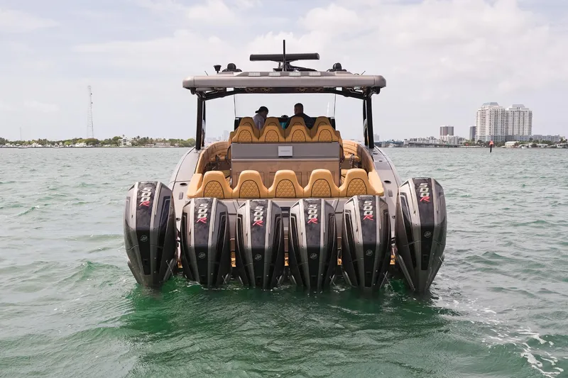 Slide: The Image of Luxury Midnight Express 52 Vitesse boat with multiple engines on open water, 2026 model. - 20