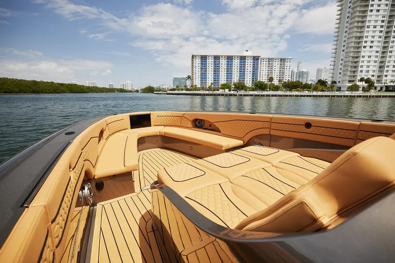 Slide: The Image of Luxurious 2026 Midnight Express 52 Vitesse boat interior with cityscape background. - 22