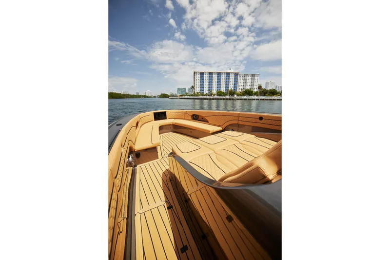 Slide: The Image of Luxurious 2026 Midnight Express 52 Vitesse yacht interior with waterfront cityscape view. - 23