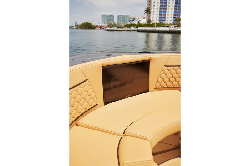 Slide: The Image of Luxurious seating on 2026 Midnight Express 52 Vitesse yacht with waterfront view. - 24