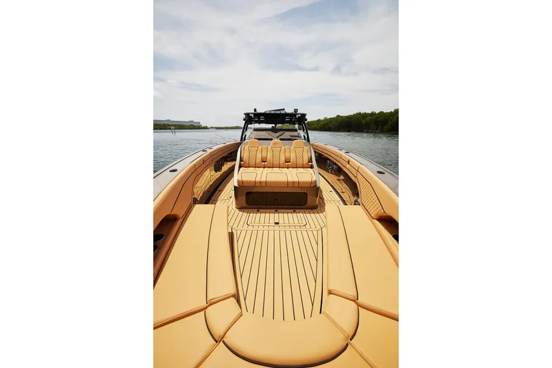 Slide: The Image of Luxurious 2026 Midnight Express 52 Vitesse yacht with elegant tan seating on open water. - 26