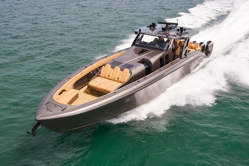 Slide: The Image of 2026 Midnight Express 52 Vitesse luxury boat cruising on open water. - 3