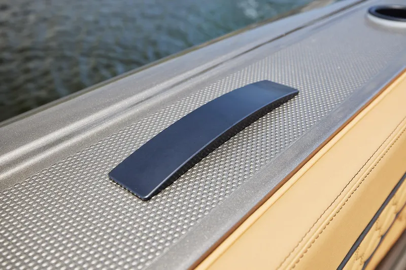 Slide: The Image of Close-up of 2026 Midnight Express 52 Vitesse boat detail with textured surface and sleek handle. - 33