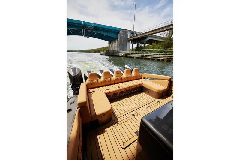 Slide: The Image of Luxurious 2026 Midnight Express 52 Vitesse boat interior with tan seating and sleek design. - 36