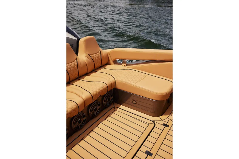 Slide: The Image of Luxurious seating on 2026 Midnight Express 52 Vitesse boat with tan upholstery and water backdrop. - 39
