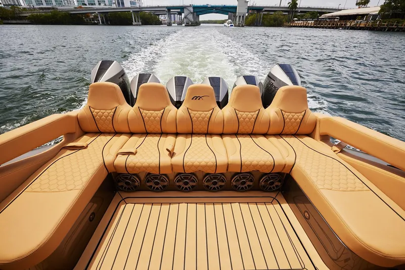 Slide: The Image of Luxurious seating on 2026 Midnight Express 52 Vitesse boat, cruising through scenic waterways. - 40