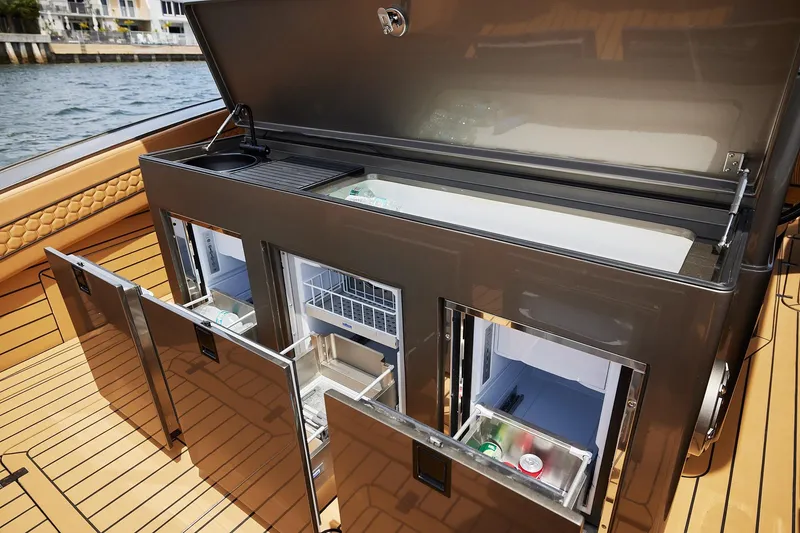 Slide: The Image of Luxury yacht kitchen on 2026 Midnight Express 52 Vitesse with open storage compartments. - 44