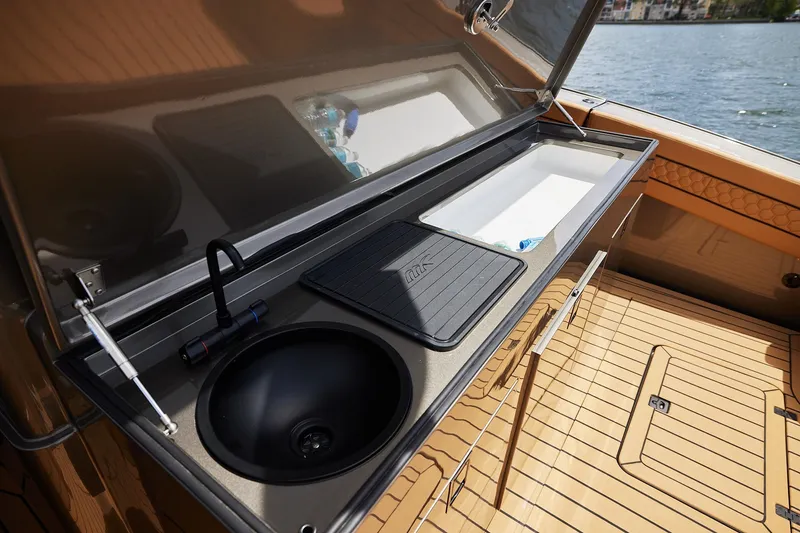 Slide: The Image of Luxury yacht kitchen area on 2026 Midnight Express 52 Vitesse, featuring sink and storage. - 45