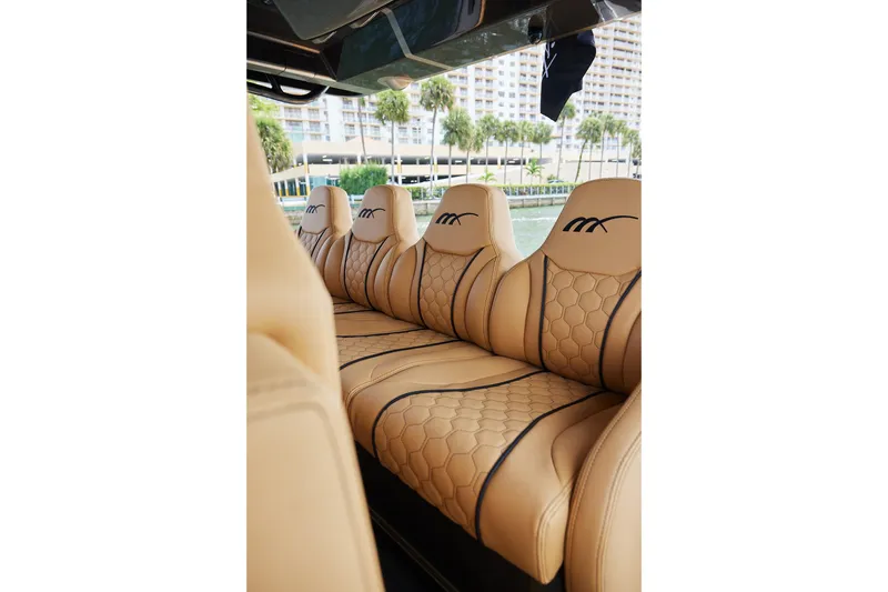 Slide: The Image of Luxurious tan leather seats in the 2026 Midnight Express 52 Vitesse boat. - 50