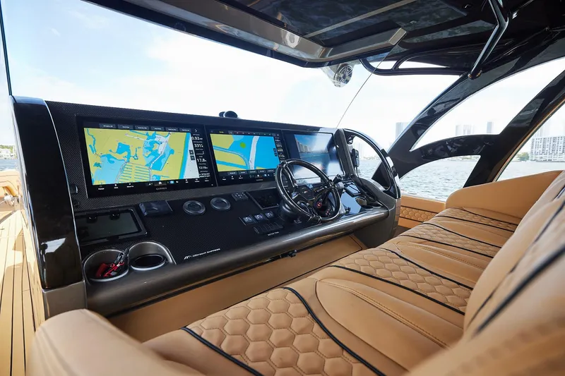 Slide: The Image of Luxurious 2026 Midnight Express 52 Vitesse yacht cockpit with advanced navigation displays. - 53