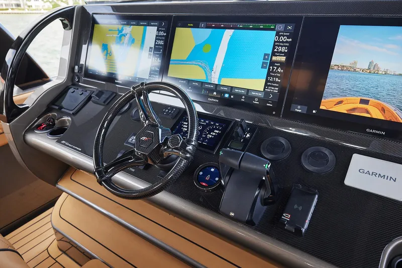 Slide: The Image of Helm of 2026 Midnight Express 52 Vitesse with advanced Garmin navigation displays. - 57