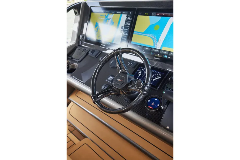 Slide: The Image of Helm of 2026 Midnight Express 52 Vitesse with advanced navigation displays. - 58