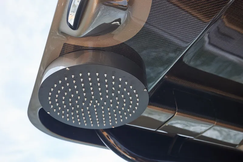 Slide: The Image of Close-up of a 2026 Midnight Express 52 Vitesse boat's sleek carbon fiber showerhead. - 60