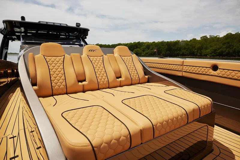 Slide: The Image of Luxurious seating on 2026 Midnight Express 52 Vitesse yacht, featuring elegant tan upholstery. - 68