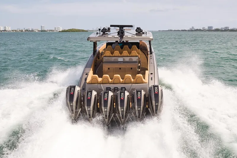 Slide: The Image of 2026 Midnight Express 52 Vitesse speedboat with six powerful engines cruising on open water. - 9