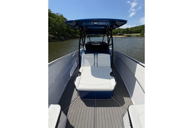 Slide: The Image of 2020 Nor-Tech 340 Sport Center Console boat on a calm river. - 10