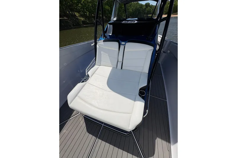 Slide: The Image of 2020 Nor-Tech 340 Sport Center Console boat with white seating and sleek design. - 11