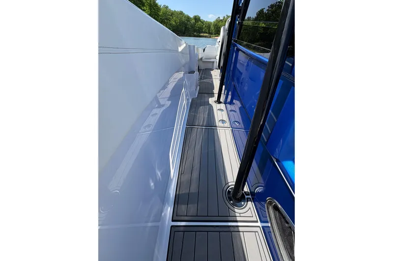 Slide: The Image of 2020 Nor-Tech 340 Sport Center Console boat deck with sleek design and modern features. - 13