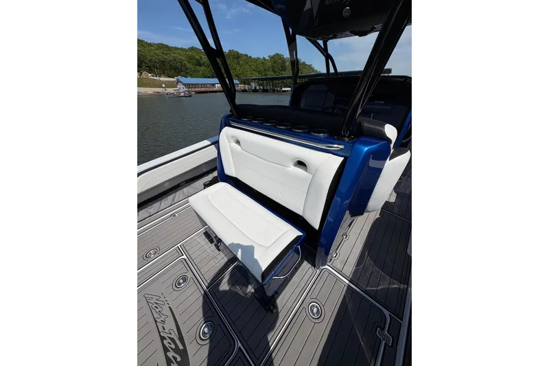 Slide: The Image of 2020 Nor-Tech 340 Sport Center Console boat interior with white seating and sleek design. - 16