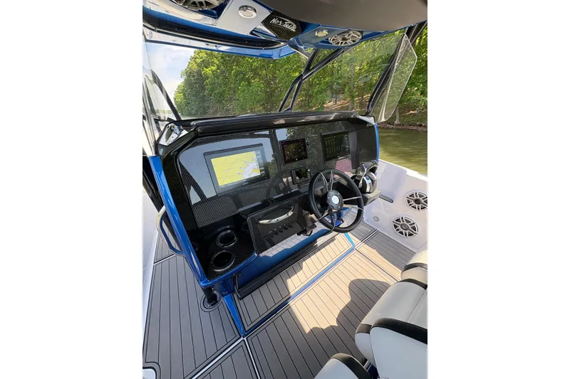 Slide: The Image of 2020 Nor-Tech 340 Sport Center Console cockpit with advanced navigation system and sleek design. - 17