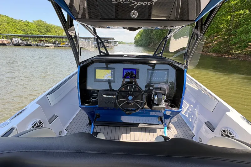 Slide: The Image of 2020 Nor-Tech 340 Sport Center Console boat interior with advanced navigation system. - 19