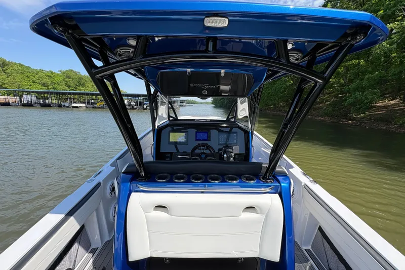Slide: The Image of 2020 Nor-Tech 340 Sport Center Console boat on a calm lake. - 20