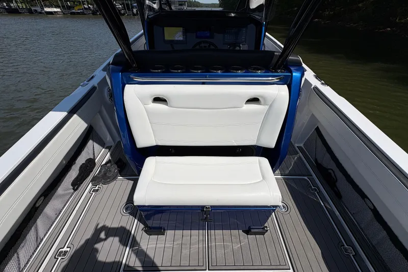 Slide: The Image of 2020 Nor-Tech 340 Sport Center Console boat interior with white seating and sleek design. - 21