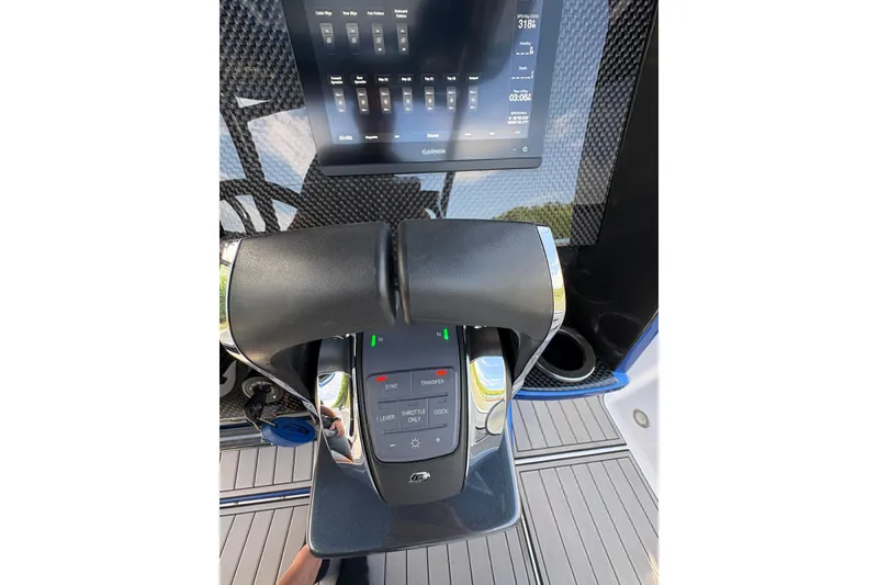 Slide: The Image of Throttle controls and display on a 2020 Nor-Tech 340 Sport Center Console boat. - 26