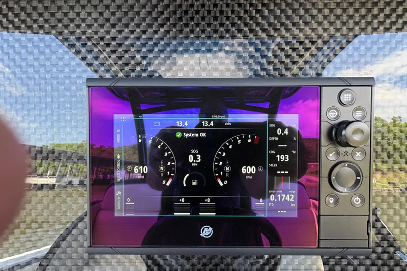 Slide: The Image of Dashboard of 2020 Nor-Tech 340 Sport Center Console with digital gauges and controls. - 28