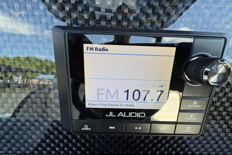 Slide: The Image of JL Audio FM radio display on Nor-Tech 340 Sport Center Console, 2020 model. - 29