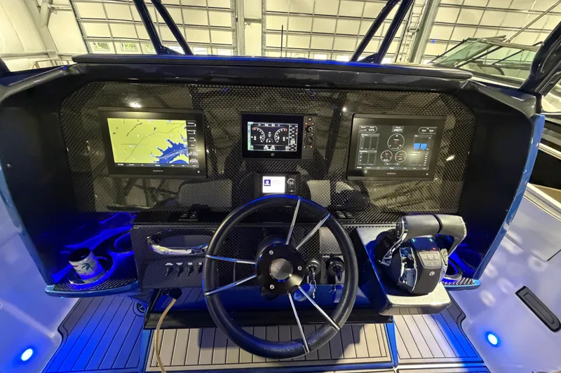 Slide: The Image of 2020 Nor-Tech 340 Sport Center Console dashboard with advanced navigation and control systems. - 36