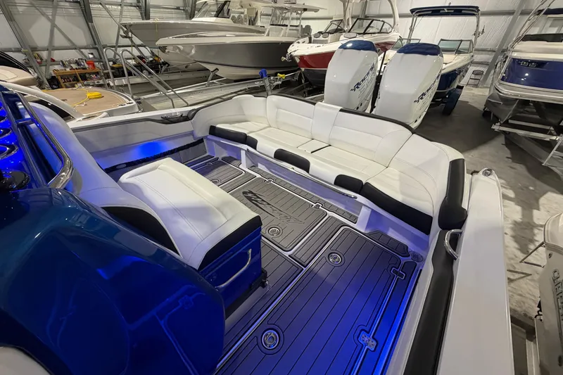 Slide: The Image of 2020 Nor-Tech 340 Sport Center Console boat interior with sleek seating and ambient lighting. - 37