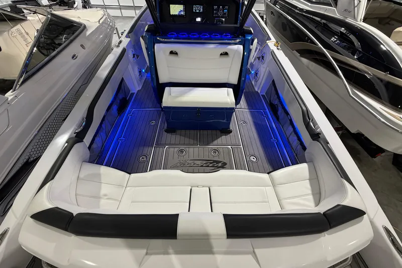 Slide: The Image of 2020 Nor-Tech 340 Sport Center Console with illuminated seating and modern dashboard. - 39