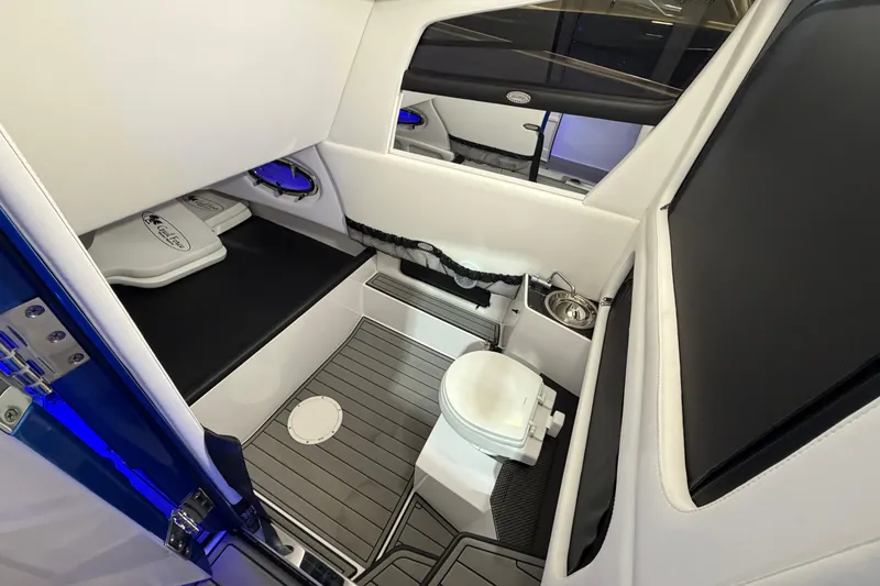 Slide: The Image of Interior of 2020 Nor-Tech 340 Sport Center Console with toilet and seating area. - 45
