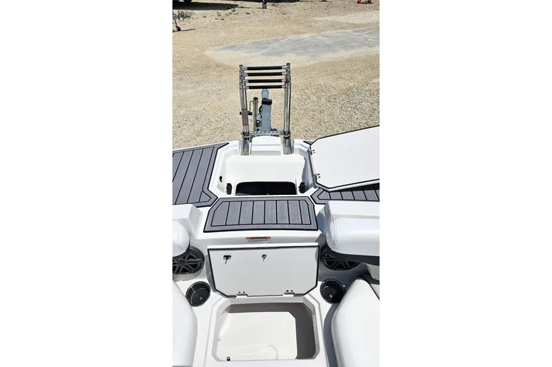 Slide: The Image of 2023 Starcraft SVX 211 OB boat interior with storage compartments and ladder. - 10