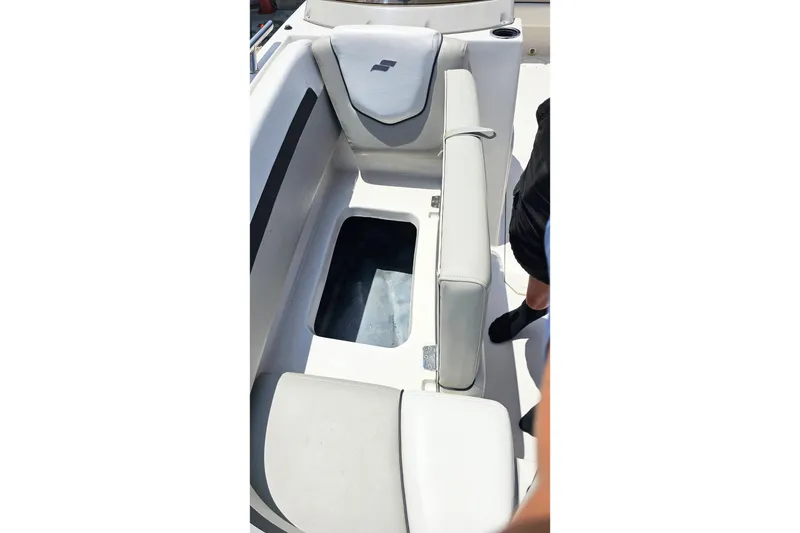 Slide: The Image of 2023 Starcraft SVX 211 OB boat interior with open storage compartment. - 12