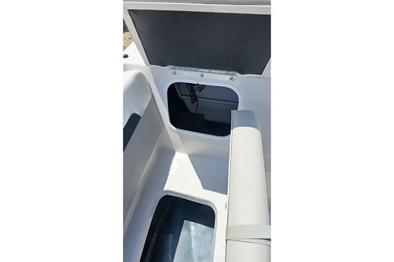 Slide: The Image of Interior storage compartment of 2023 Starcraft SVX 211 OB boat. - 13