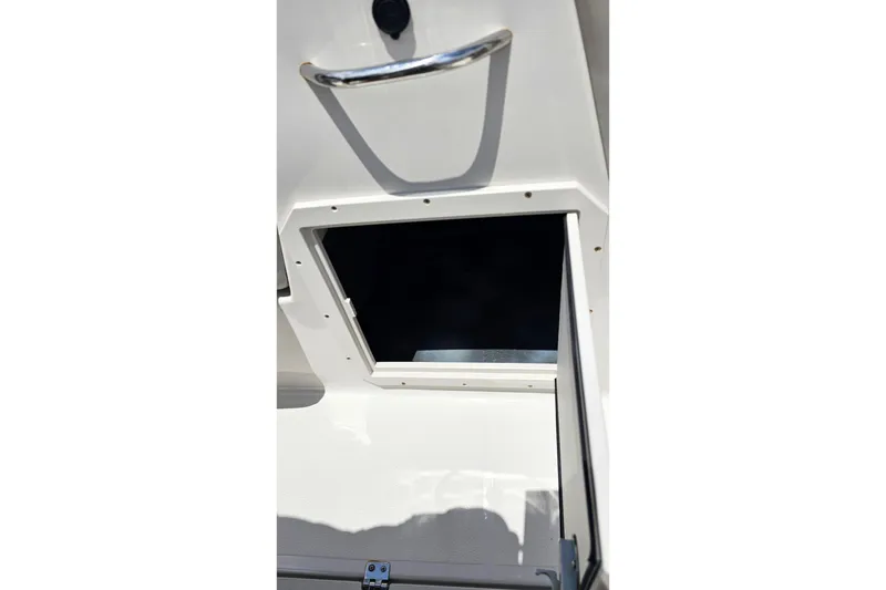 Slide: The Image of Open storage compartment on 2023 Starcraft SVX 211 OB boat. - 14