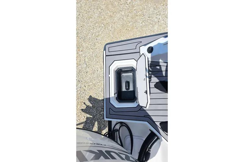 Slide: The Image of 2023 Starcraft SVX 211 OB boat deck with storage compartment and sleek design. - 19