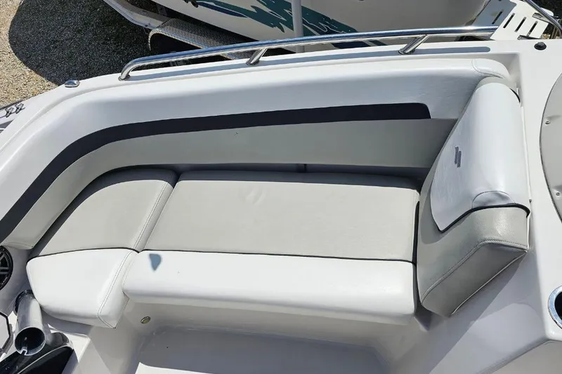 Slide: The Image of 2023 Starcraft SVX 211 OB boat interior with sleek white seating and modern design. - 7