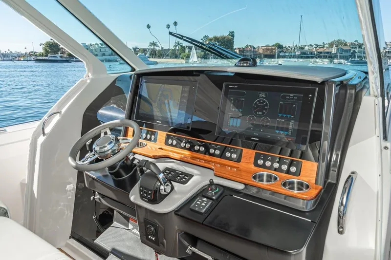 Slide: The Image of Interior view of 2019 Tiara Yachts 38 LS helm with modern electronics. - 16
