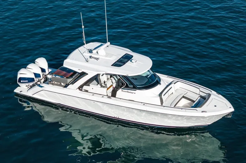Slide: The Image of 2019 Tiara Yachts 38 LS on calm water. - 2