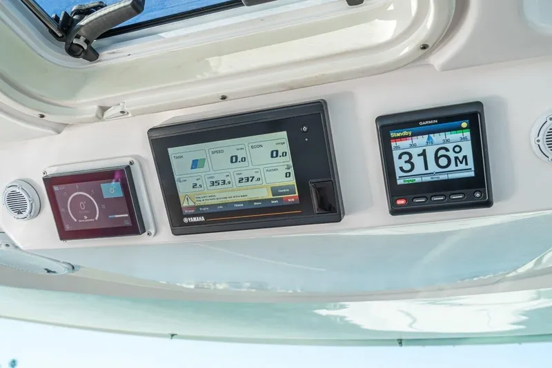Slide: The Image of Dashboard of 2019 Tiara Yachts 38 LS with Garmin and Yamaha displays. - 21